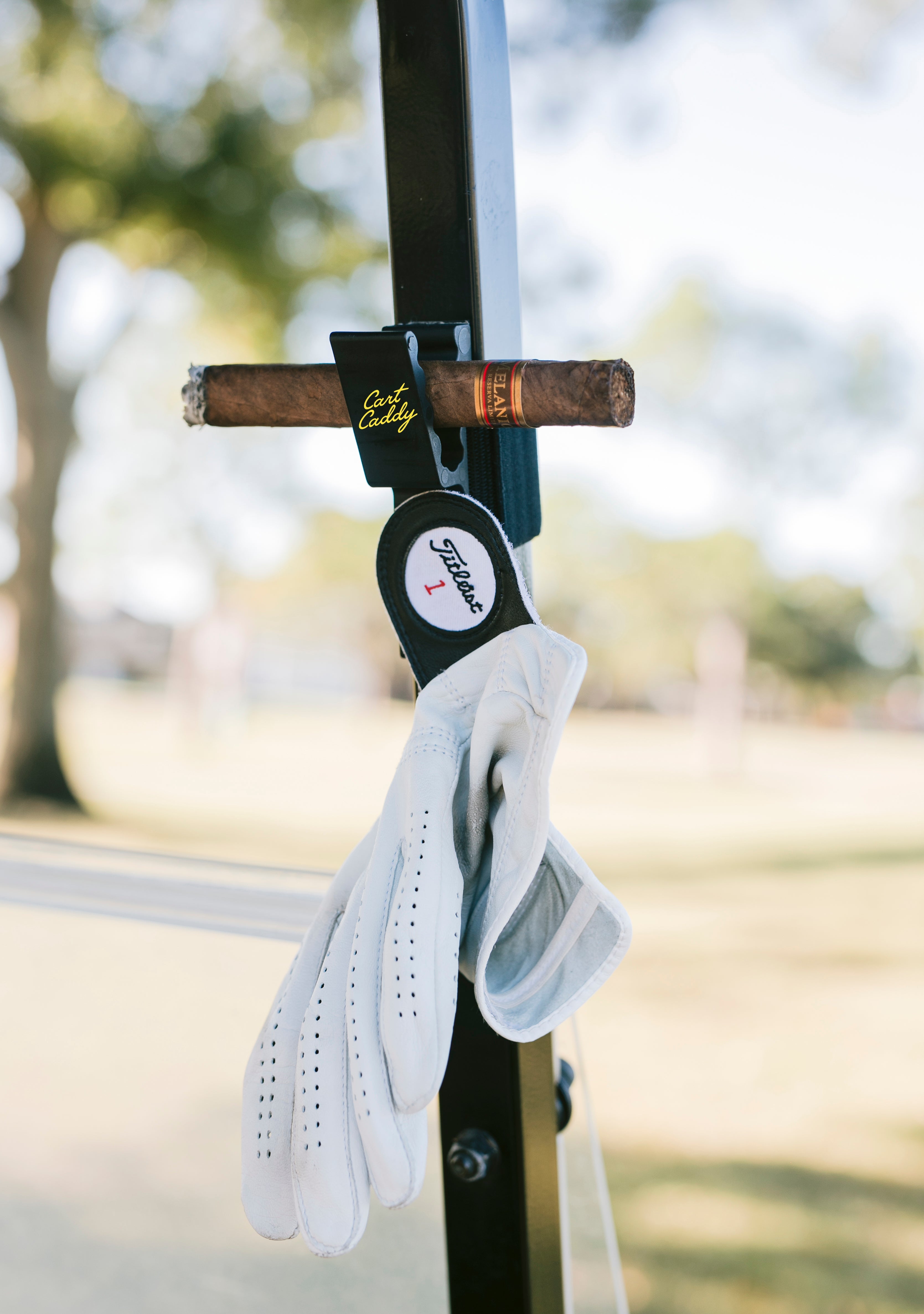 The original Cart Caddy glove and cigar holder
